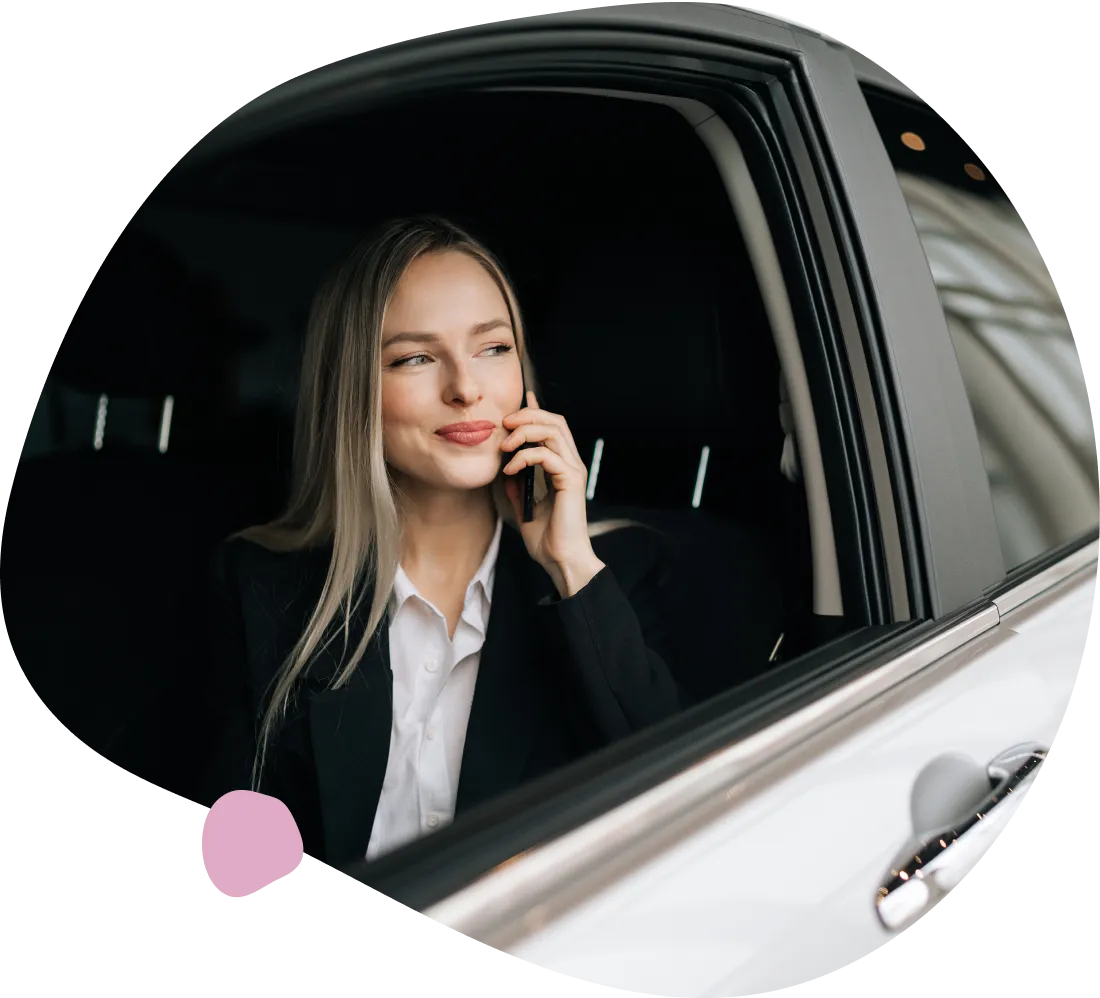 Businesswoman on phone in car.